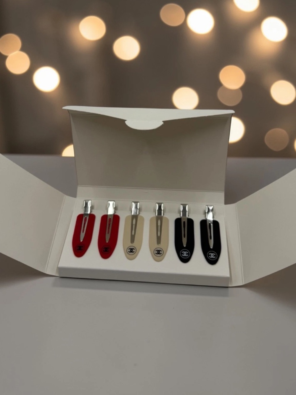 CHANEL Red, Beige, and Black Enamel Logo Hair Clips Set - Picture 2 of 6